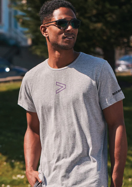Image showcasing a man wearing sunglasses and Accentures Marine Layer Unisex Signature Tee.